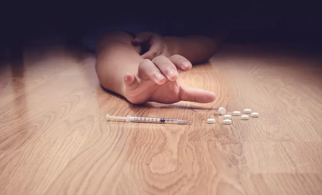 Drug addict's hand trying to catch the drugs | Drug Abuse | One of the main causes of mental health problems